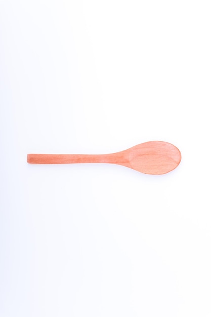 Photo directly above shot of wooden spoon on white background