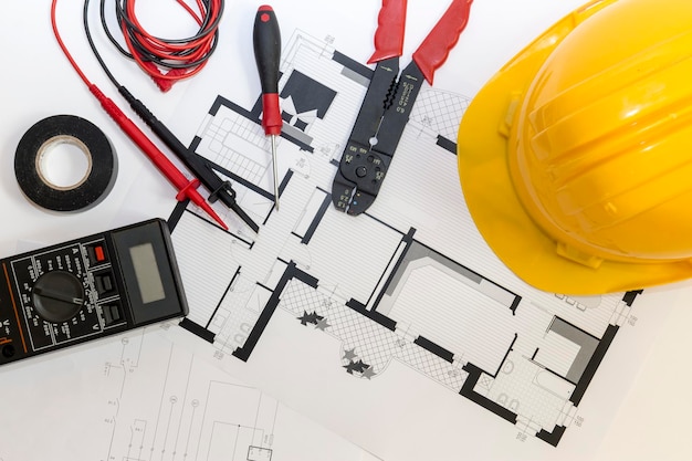 Photo directly above shot of work tools and blueprint on table