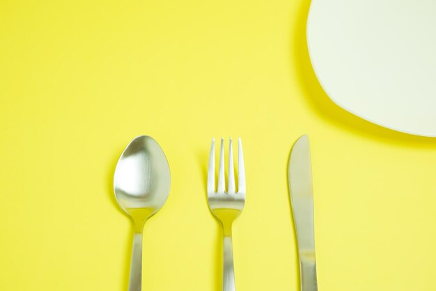 Directly above shot of yellow and spoon on table