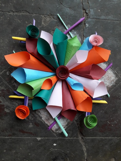 Photo directly above view of colorful paper cones on floor