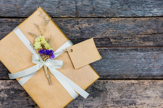 Directly above view of flower on gift over table