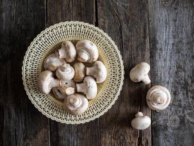 Directly above view of fresh mushrooms on wooden table