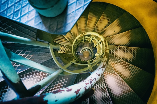 Photo directly above view of metallic spiral staircase