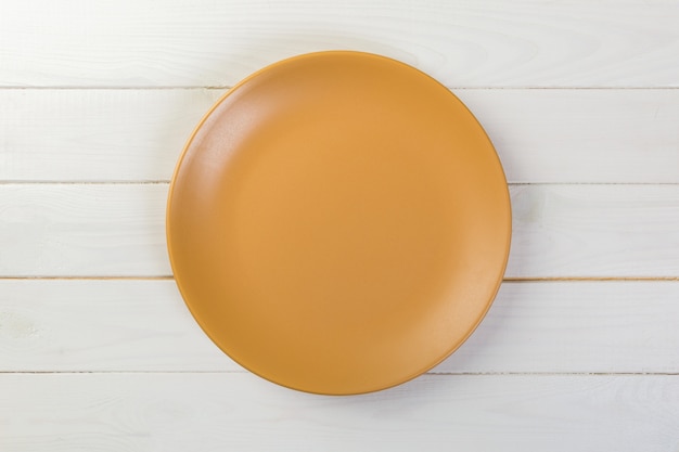 Photo directy above empty orange matte dish