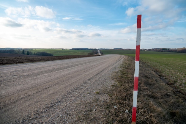 Dirt road in a field outside the city