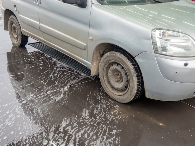 Dirty auto at a selfservice car wash