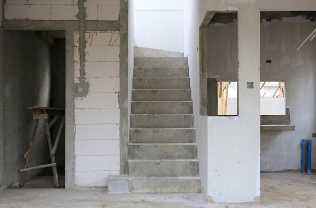 Dirty cement staircase in the new house under construction