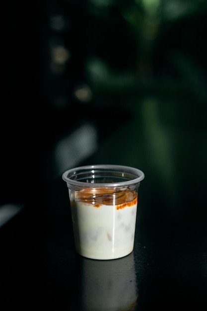 Dirty Coffee - A glass of espresso shot mixed with cold fresh milk in coffee shop cafe and restauran