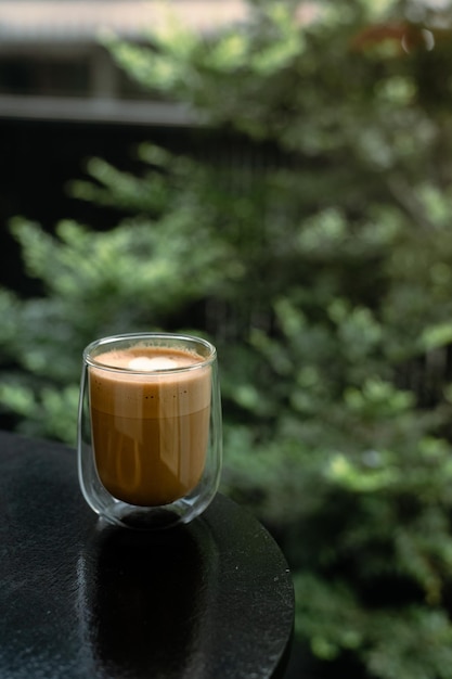 Dirty Coffee - A glass of espresso shot mixed with cold fresh milk in coffee shop cafe and restauran