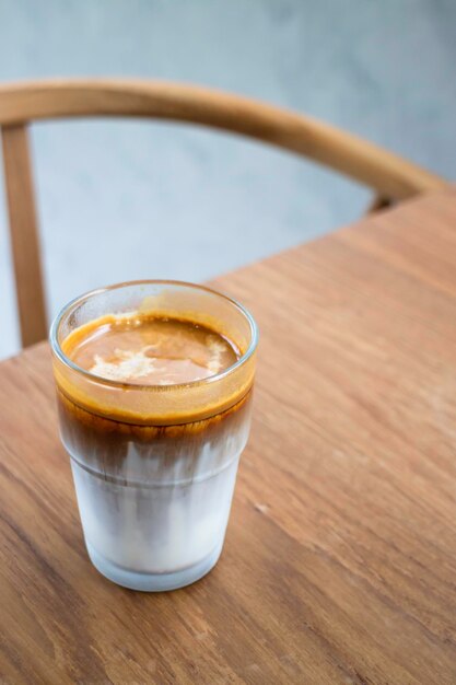 Dirty coffee on wooden table stock photo