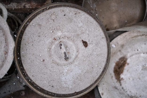 Dirty dusty cobwebbed old kitchen utensils in an abandoned apartment closeup