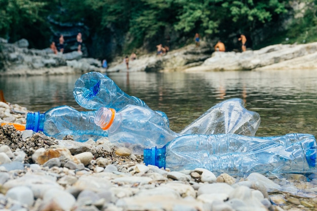 Dirty plastic bottles in water