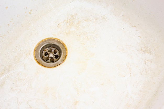 Dirty sink surface dirty dishwasher with stains and grease