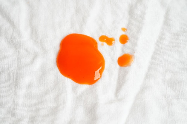 Dirty spicy sauce stain on cloth to wash with washing powder\
cleaning housework concept