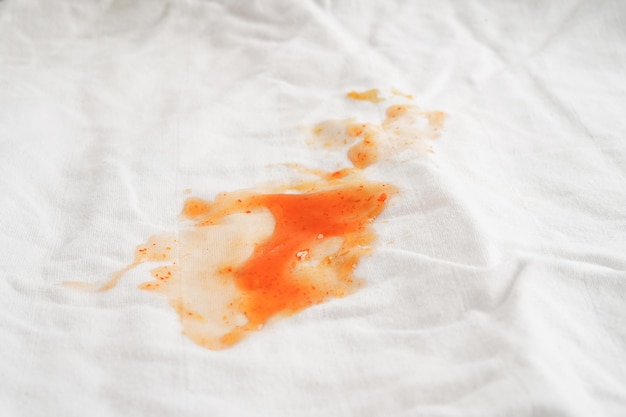 Dirty tomato sauce stain or ketchup on cloth to wash with washing powder cleaning housework concept