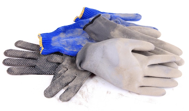 Dirty used gloves isolated on white