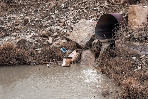 Dirty waste water from the pipe, environmental pollution