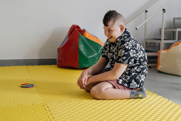 Disabled child doing sensory activity with toys rehabilitation