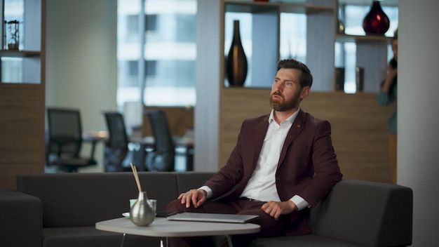 disappointed boss feeling sad opening laptop at workplace ceo typing computer