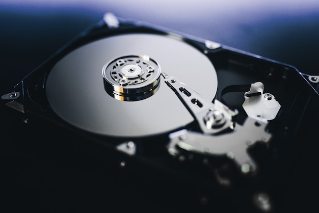 disassembled hard drive from the computer, hdd with mirror effect. opened hard drive from the computer hdd with mirror effects. part of computer pc, laptop