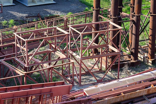 Disassembled temporary supports and scaffolding at the\
construction site