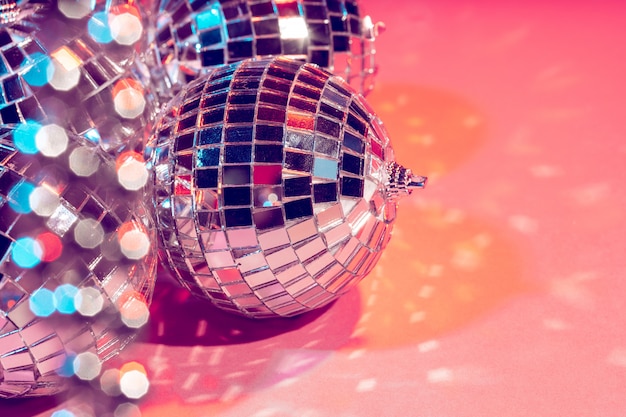 Disco ball bauble on pink background.  party concept