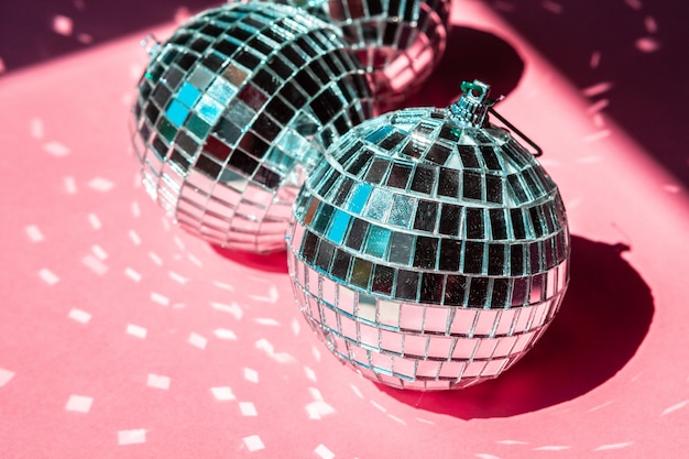 Photo disco ball bauble on pink ,  party concept