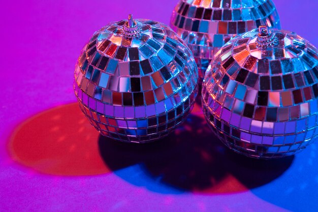 Disco ball shines on purple background close up