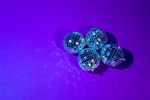 Disco ball shines on purple  close up