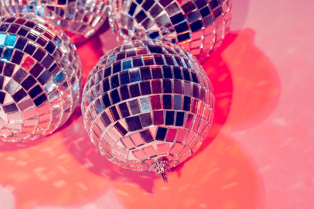 Premium Photo  Disco balls for decorationof a party on pink background