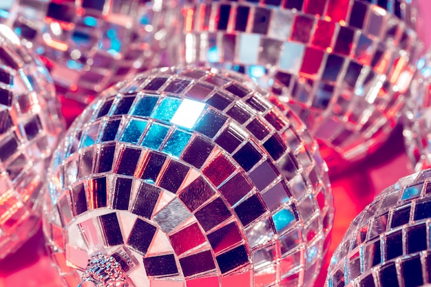 Disco balls for decorationof a party on  pink  background