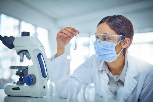 Discovering solutions through science Shot of a young scientist working in a lab