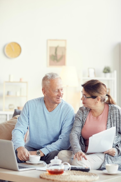 Discussing family budget over cup of tea