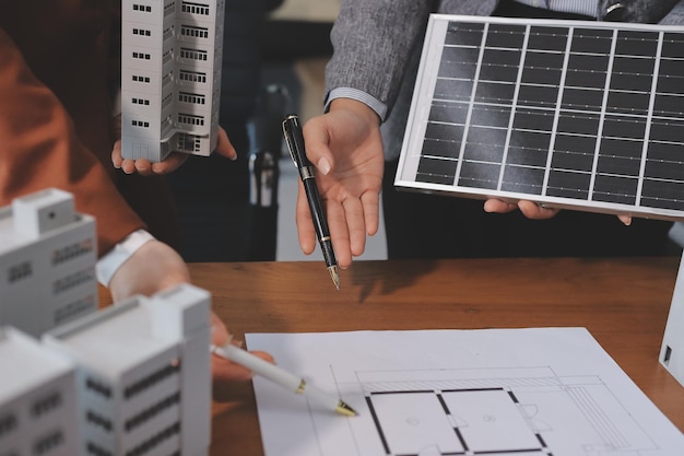 discussion among businesspeople on the latest developments in solar cell panel technology and solar energy environment city concept