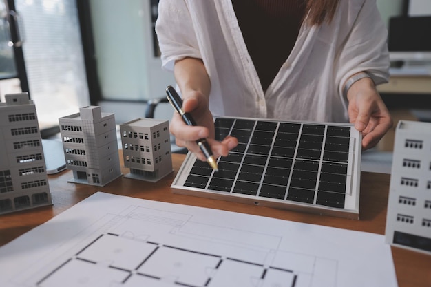 discussion among businesspeople on the latest developments in solar cell panel technology and solar energy environment city concept
