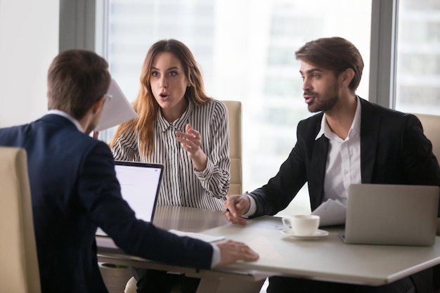 disgruntled workers or dissatisfied angry clients customers arguing having complaint dispute conflict with lawyer about bad contract demanding fraud compensation negotiating at work office meeting