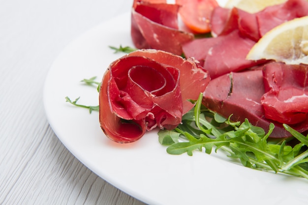 Dish of bresaola and aragula