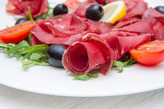 Dish of bresaola and aragula