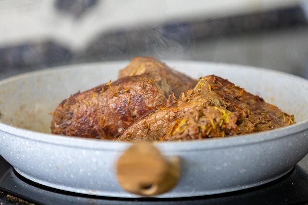 A dish of food with a smoke coming out of it