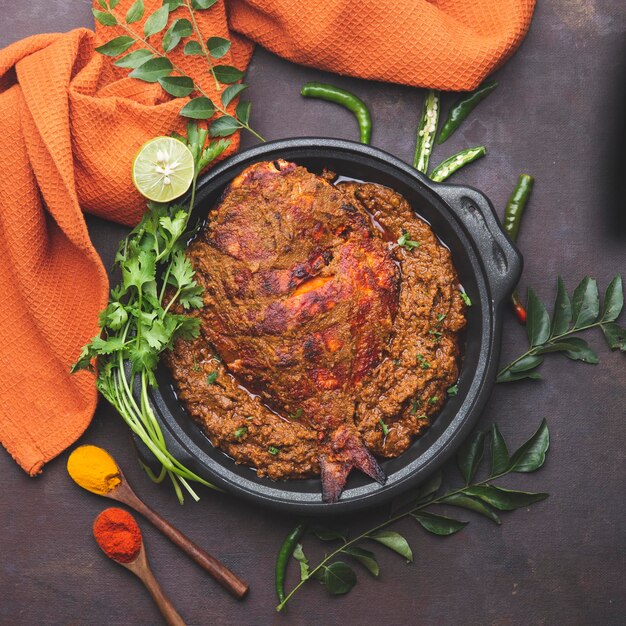 A dish of food with a spoon and a bowl of food on it