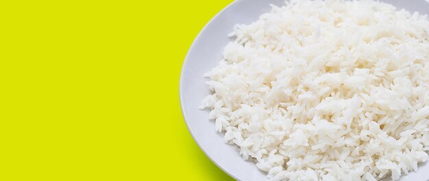 Dish of rice on green background