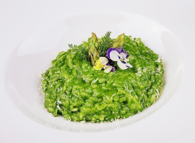 Dish of risotto with asparagus closeup