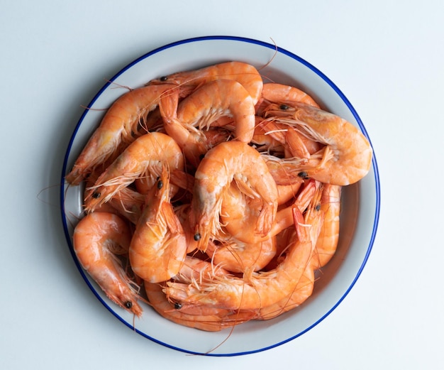 Dish of shrimps cooked on white bottom Copy space