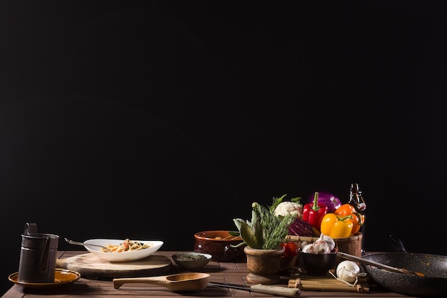 Dish of Spaghetti and fresh Vegetables on the kitchen table