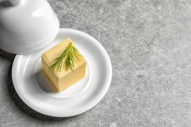 Dish with fresh butter on table space for text