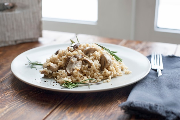 Dish with mushroom and couscous in plate