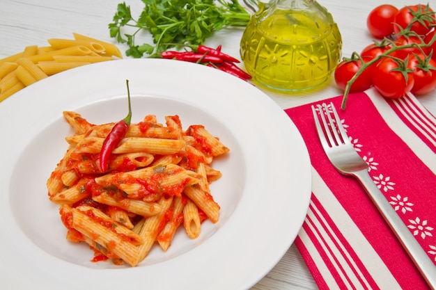 Photo dish with penne and arrabbiata sauce