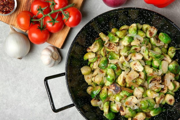 Dish with roasted brussel sprouts on table