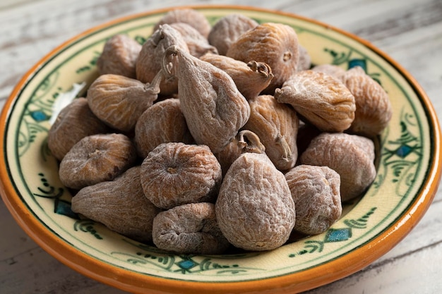 Dish with sweet dried small spanish figs close up