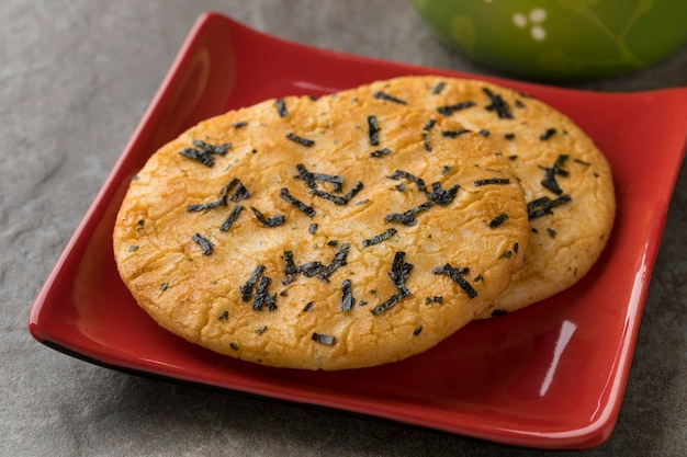 Dish with traditional Japanese rice crackers and seaweed